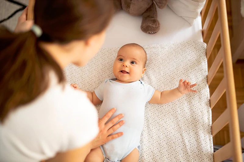 Baby hitting head outlet on side of crib