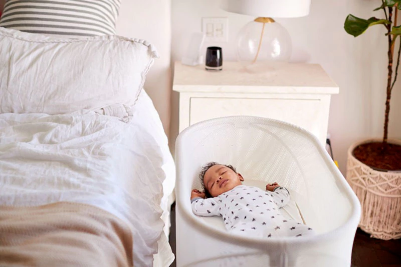 Things to consider before buying a bassinet for tall bed
